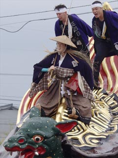 雨模様のときは亀と浦島太郎は笠と蓑をかぶります